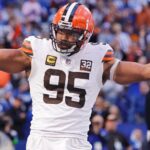 Cleveland Browns defensive end Myles Garrett (number 95) stands on the football field during a game