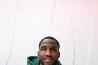 Josh Johnson signing a contract.