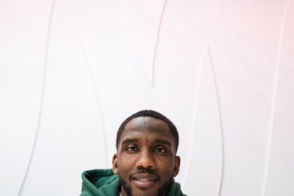 Josh Johnson signing a contract.