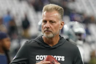 Dallas Cowboys defensive coordinator Matt Eberflus on the field during pregame at AT&T Stadium.