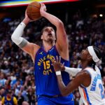 Shai Gilgeous-Alexander defends Nikola Jokic during Thunder vs Nuggets playoff game
