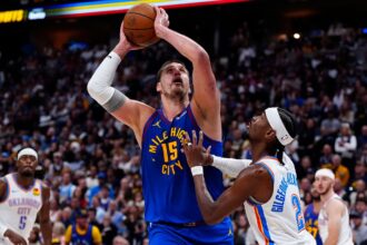 Shai Gilgeous-Alexander defends Nikola Jokic during Thunder vs Nuggets playoff game