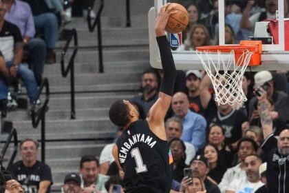 Victor Wembanyama dunking.
