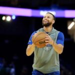 Stephen Curry warms up before game against Milwaukee Bucks at Fisery Forum