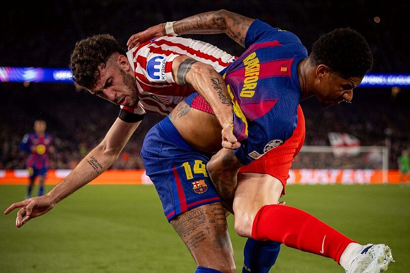 Barcelona's Rashford battles with Atletico's Ruggeri