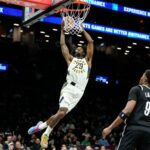 Indiana Pacers forward Obi Toppin drives Brooklyn Nets forward Jalen Wilson during the first half of an NBA game in New York on Thursday April, 9, 2026