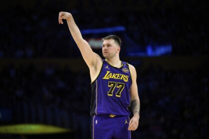 Los Angeles Lakers guard Luka Doncic watches his 3-point shot go in during the second half of an NBA basketball game against the New Orleans Pelicans, Friday, April 4, 2025, in Los Angeles.