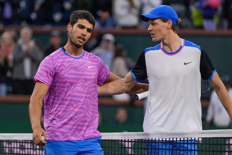 Spain's Carlos Alcaraz, left, talks with Italy's Jannik Sinner after defeating him in a semifinal match at the BNP Paribas Open tennis tournament, Saturday, March 16, 2024 [Ryan Sun/AP]