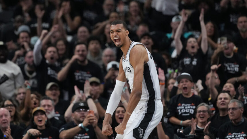 San Antonio Spurs forward/center Victor Wembanyama reacts after a play during the first half in Game 5 of a first-round NBA playoffs basketball series against the Portland Trail Blazers, in San Antonio, Tuesday, April 28, 2026. (AP Photo/Eric Gay)