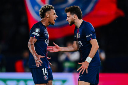 Doue and Kvarastkhelia celebrate after PSG win over Bayern