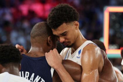 Spurs' Wembanyama being consoled by opponent