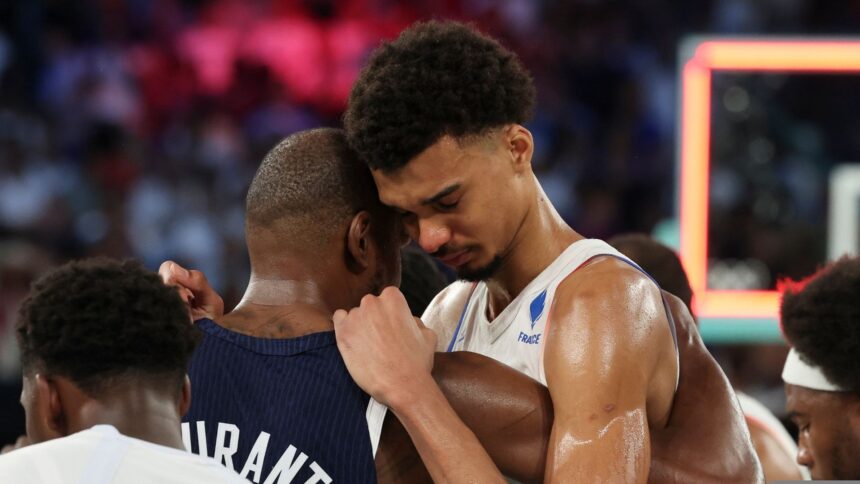 Spurs' Wembanyama being consoled by opponent