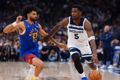 Minnesota Timberwolves guard Anthony Edwards (5) drives to the basket against Denver Nuggets guard Jamal Murray (27) during the second half in Game 2 of a first-round NBA playoffs basketball series Monday, April 20, 2026, in Denver. Credit: AP/Jack Dempsey