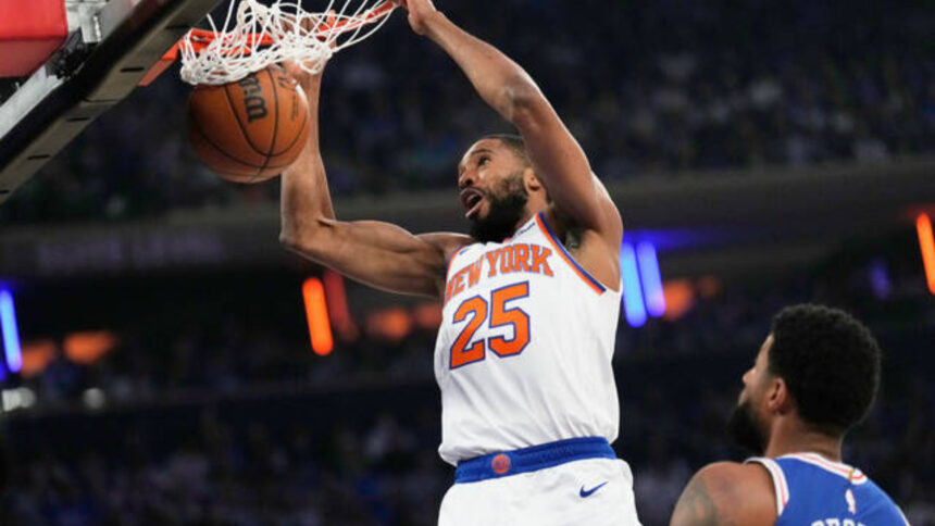 The Knicks’ Mikal Bridges dunks in the first half against Philadelphia during Game 1 of their Eastern Conference second-round game Monday. (AP)