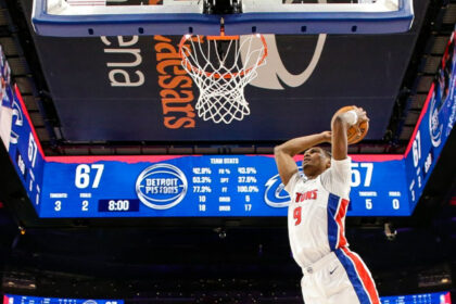 Ausar Thompson goes up for a dunk in a game against the Cleveland Cavaliers, with the scoreboard showing the teams tied at 67 during the second half.