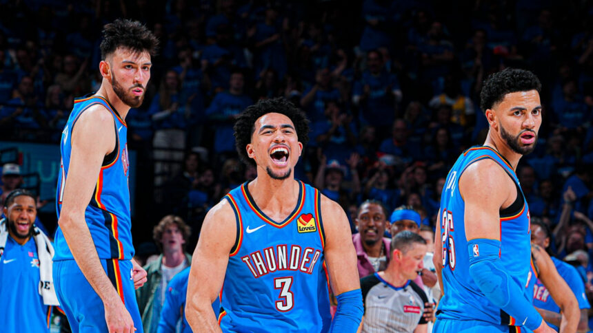 Oklahoma City Thunder players Chet Holmgren, Ajay Mitchell, and Alex Caruso celebrate on the court during their 108-90 Game 1 victory over the Los Angeles Lakers.