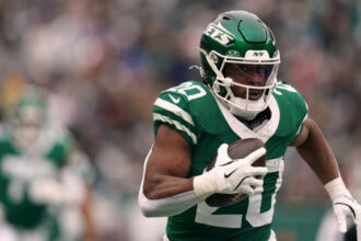 New York Jets running back Breece Hall (20) carries the ball during an NFL football game against the New England Patriots, Dec. 28, 2025, in New York. (AP Photo/Vera Nieuwenhuis, File)