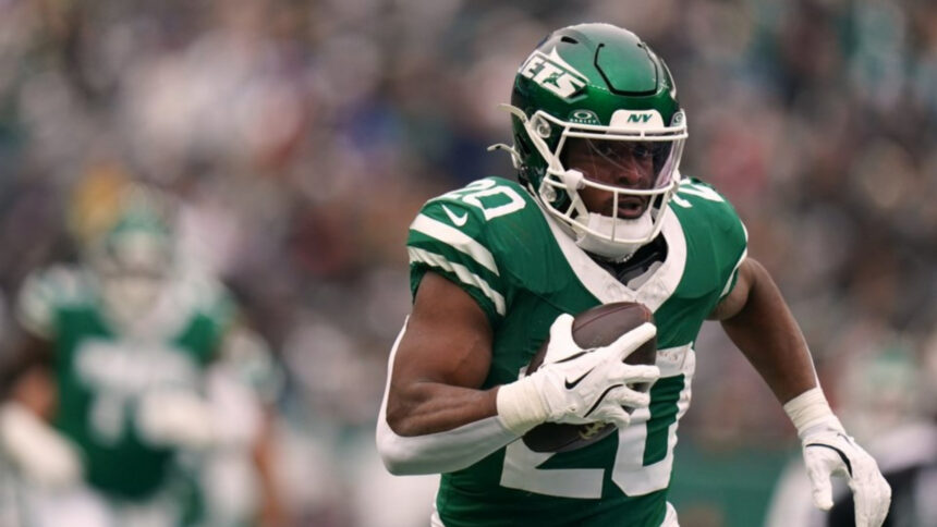 New York Jets running back Breece Hall (20) carries the ball during an NFL football game against the New England Patriots, Dec. 28, 2025, in New York. (AP Photo/Vera Nieuwenhuis, File)
