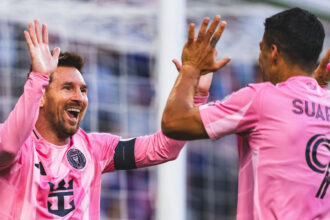 Lionel Messi celebrate with Luis Suarez in 5-3 win over Cincinnati