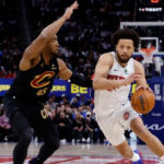 Detroit Pistons PG Cade Cunningham drives to the basket on Cleveland Cavaliers SG Donovan Mitchell in Game 1 of their second-round series of the 2026 NBA Playoffs at Little Caesars Arena in Michigan.