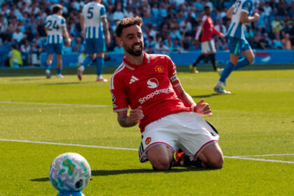 Fernandes slides after scoring United 's third goal to cap off the 2025/26 EPL season