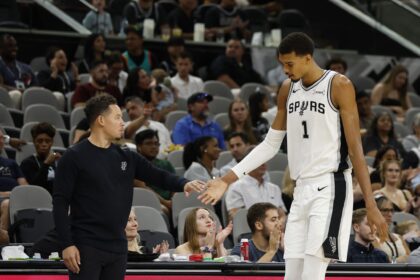 San Antonio Spurs Victor Wembanyama (1) gets congratulation from San Antonio Spurs head coach Mitch Johnson in a Spurs preseason opener vs. Guangzhou Loong-Lions on Monday, Oct. 6, 2025 at Frost Bank Center.