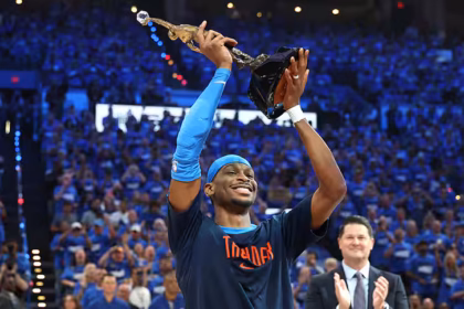 Shai Gilgeous-Alexander lifts the Michael Jordan MVP Trophy in front of a home crowd before an Oklahoma City Thunder game in Oklahoma on May 22. After a stellar season, the 26-year-old from Hamilton, Ontario, was named the NBA’s most valuable player.