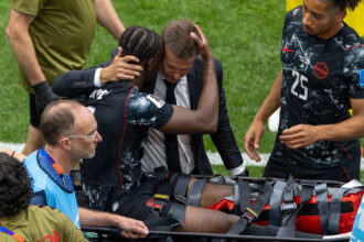 Jesse Marsch embraces Ismael Kone after leg-breaking injury