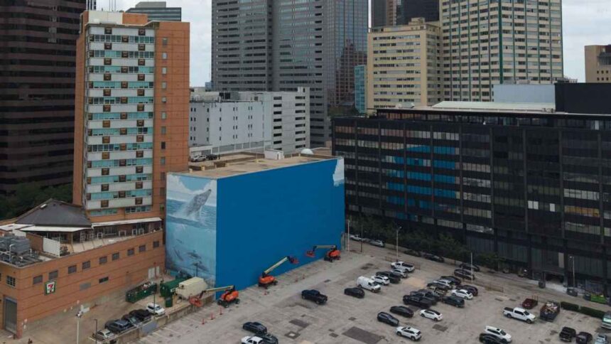 A mural known as the "Whaling Wall 82," created by artist Wyland, was painted over ahead of the World Cup.