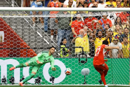 Switzerland's Ruben Vargas scores a penalty past Colombia's Camilo Vargas to win the penalty shootout