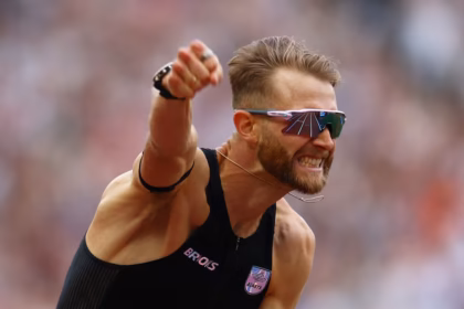 Britain's Josh Kerr celebrates after winning the men's 1 mile final and setting a new Meet Record, World Record, and Diamond League