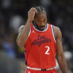 Los Angeles Clippers forward Kawhi Leonard heads to the bench during a timeout against in the second half of Game 7 of an NBA basketball first-round playoff series against the Denver Nuggets, Saturday, May 3, 2025, in Denver.