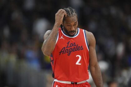 Los Angeles Clippers forward Kawhi Leonard heads to the bench during a timeout against in the second half of Game 7 of an NBA basketball first-round playoff series against the Denver Nuggets, Saturday, May 3, 2025, in Denver.