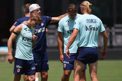Norway's head coach Staale Solbakken with Martin Odegaard and Erling Haaland during a training session