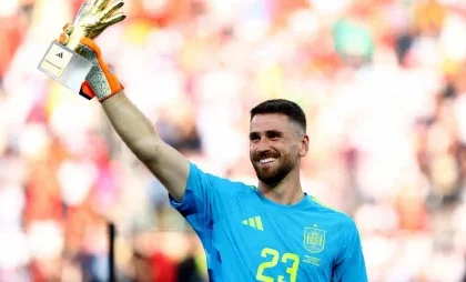 Spain's Unai Simon celebrates after winning the Golden glove award
