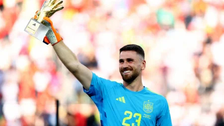 Spain's Unai Simon celebrates after winning the Golden glove award
