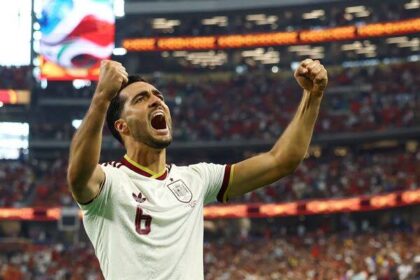 Spain substitute Mikel Merino celebrates his late match-winning goal against Portugal in the World Cup round of 16 in Arlington, Tex., on Monday.