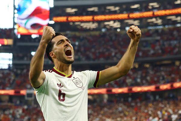 Spain substitute Mikel Merino celebrates his late match-winning goal against Portugal in the World Cup round of 16 in Arlington, Tex., on Monday.