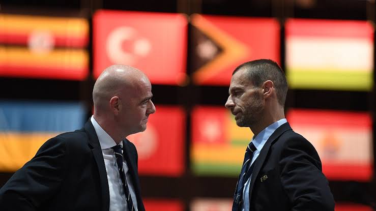 UEFA President Aleksander Ceferin (R) talks to FIFA President Gianni Infantino at the 67th FIFA Congress at the Bahrain International Exhibition and Convention Center in Manama, Bahrain, May 11, 2017.