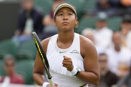 Naomi Osaka of Japan reacts after winning a point against Diane Parry of France during their first round match of the Wimbledon tennis championships in London, Monday, July 1, 2024. (AP Photo/Kirsty Wigglesworth)