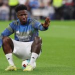 Vinicius Jr. sits on the ball during a warm up ahead of Valencia clash at the Bernabeu on Nov 1, 2025