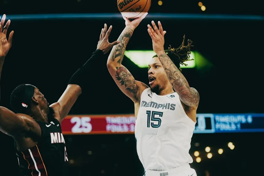 Memphis Grizzlies’ Brandon Clarke (15) floats the ball against the Miami Heat’s Bam Adebayo (13) during a game on Saturday, March 15, 2025 at the FedEx Forum in Memphis, Tenn.