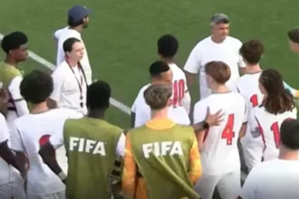 England players gathered at the side of the pitch after the alleged incident
