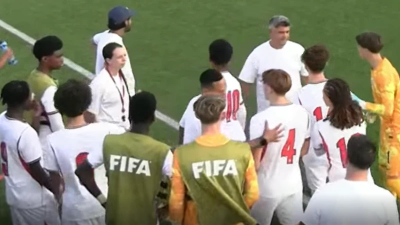 England players gathered at the side of the pitch after the alleged incident