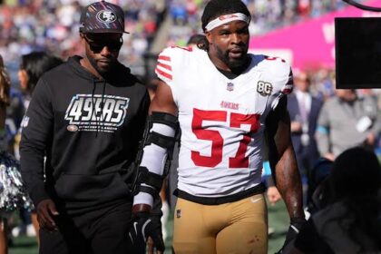 San Francisco 49ers linebacker Dre Greenlaw (57) leaves the field after being ejected during the first half of an NFL football game against the Seattle Seahawks, Sunday, Oct. 11, 2026, in Seattle.